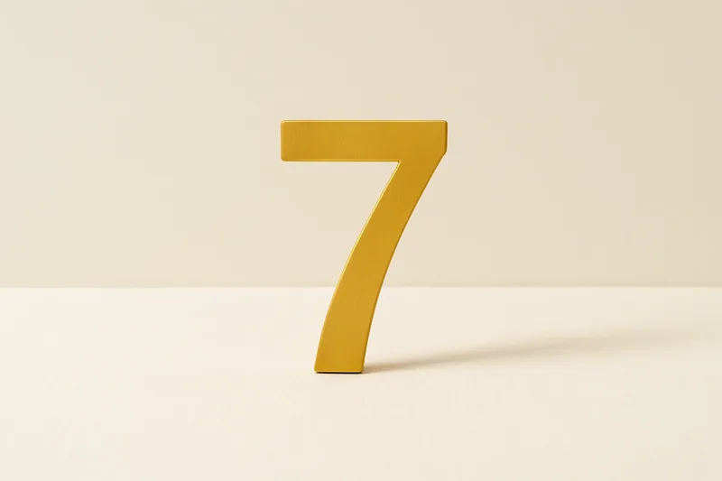 Single large golden seven symbol on cream background with soft shadow